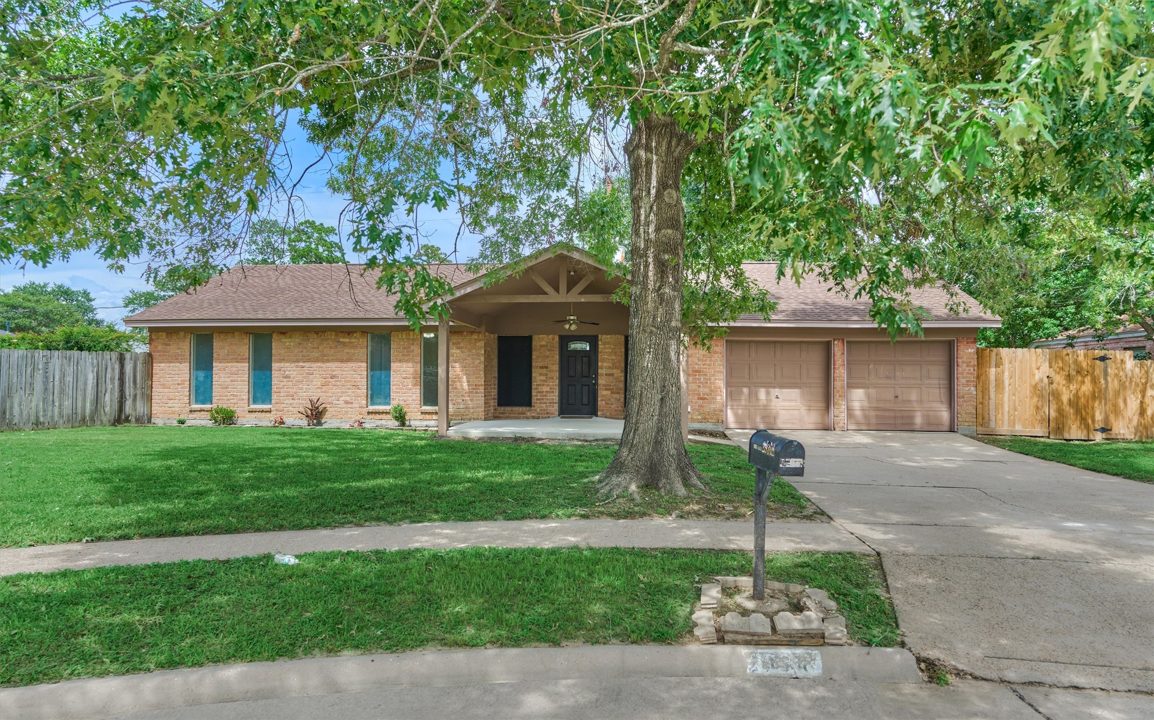 29318 Waltham Street Spring, TX 77386 - Photo 3 of 28 a front view of a house with a garden and plants