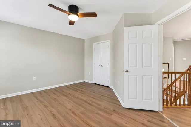 a kitchen with kitchen island granite countertop wooden cabinets and a sink