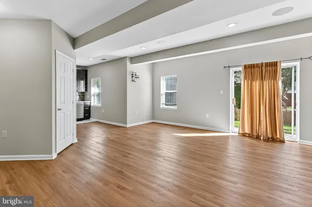 a bathroom with a granite countertop sink toilet a mirror and shower