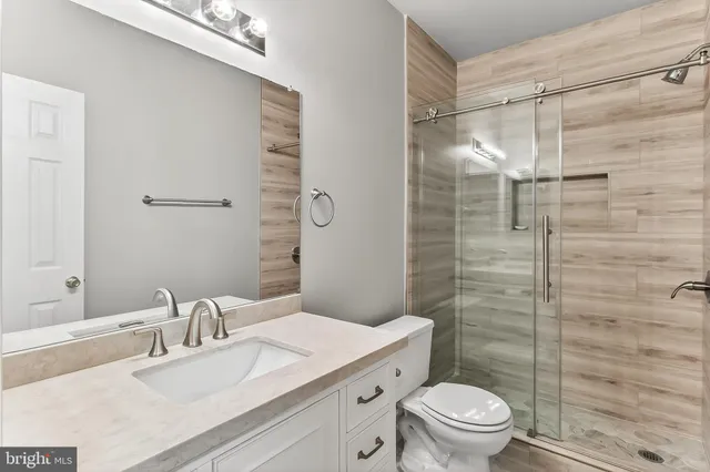 a backyard of a house with lots of green space and trampoline