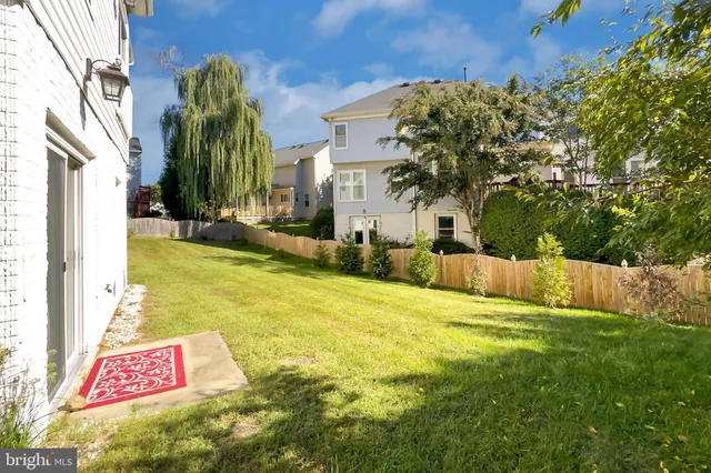 a view of a pathway of a house with a yard