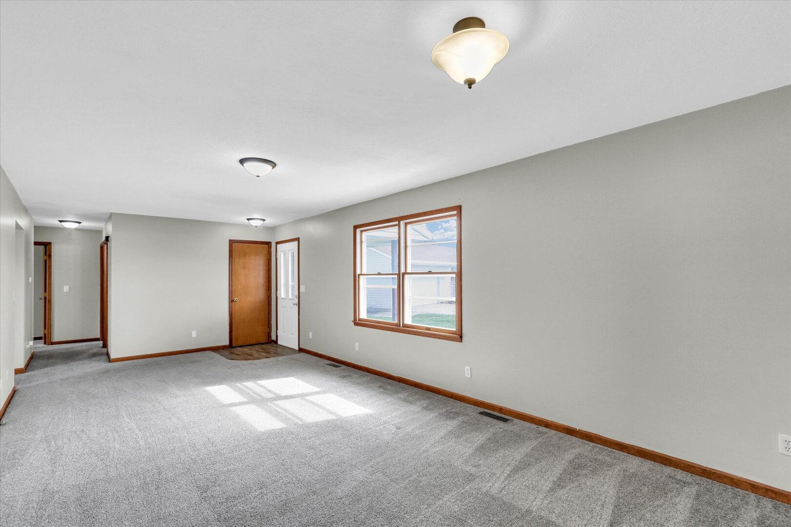 3330 West William Street Champaign, IL 61821 - Photo 14 of 28 an empty room with windows