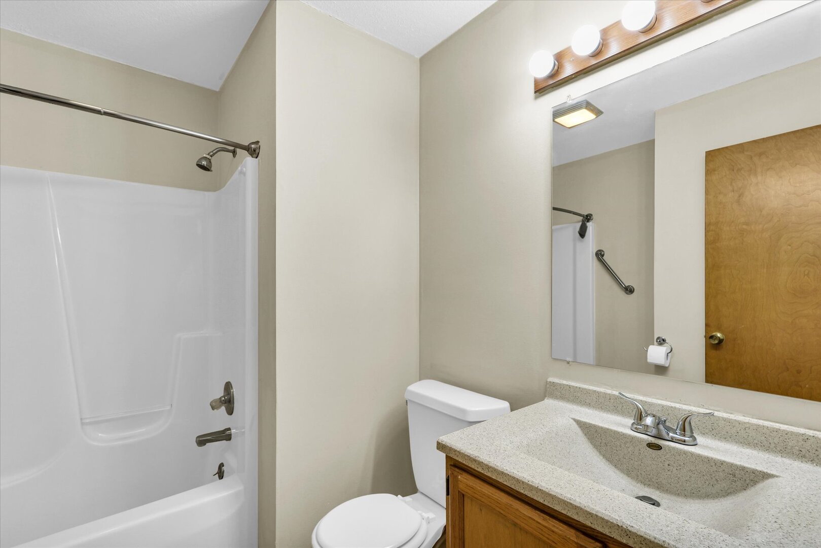 3330 West William Street Champaign, IL 61821 - Photo 27 of 28 a bathroom with a sink toilet and shower