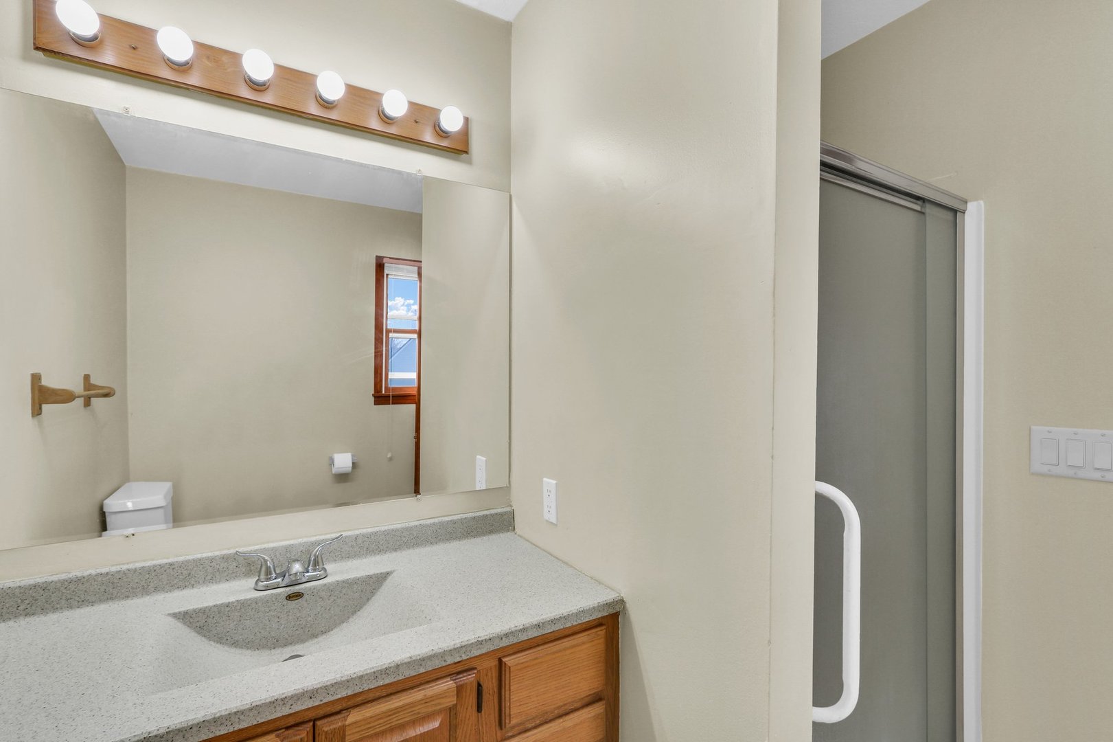3330 West William Street Champaign, IL 61821 - Photo 28 of 28 a bathroom with a sink vanity and a mirror