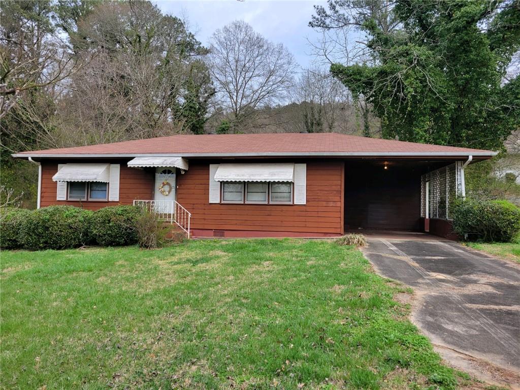 2415 Flannery Street Southwest Rome, GA 30161 - Photo 1 of 1 a front view of a house with garden