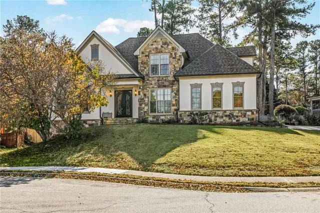 a front view of a house with garden