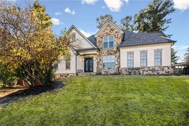 a front view of a house with a yard