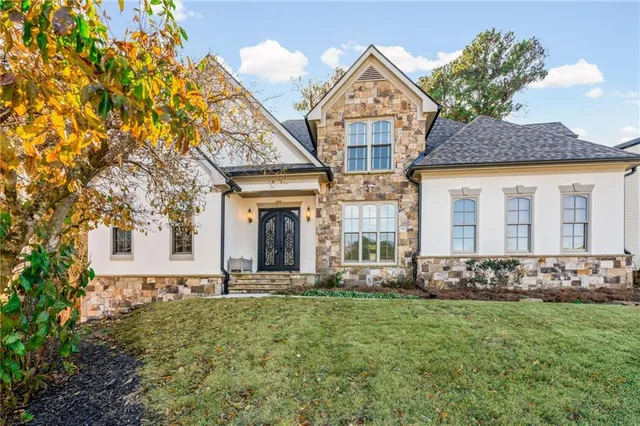 a front view of a house with garden