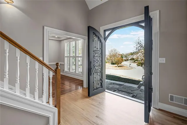 a view of an entryway with wooden floor