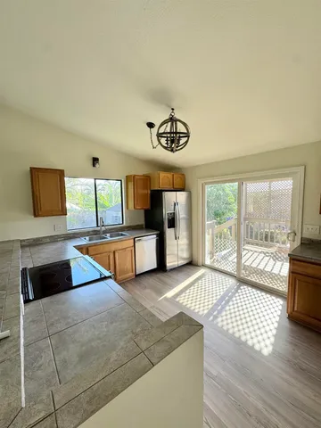 a bedroom with a large bed and a large window