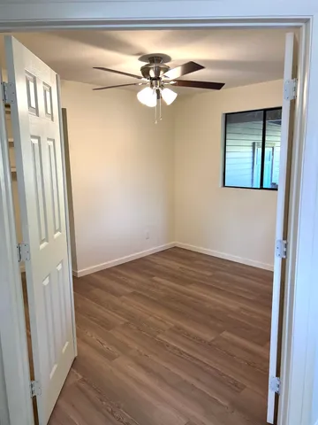a view of a hallway with a chandelier