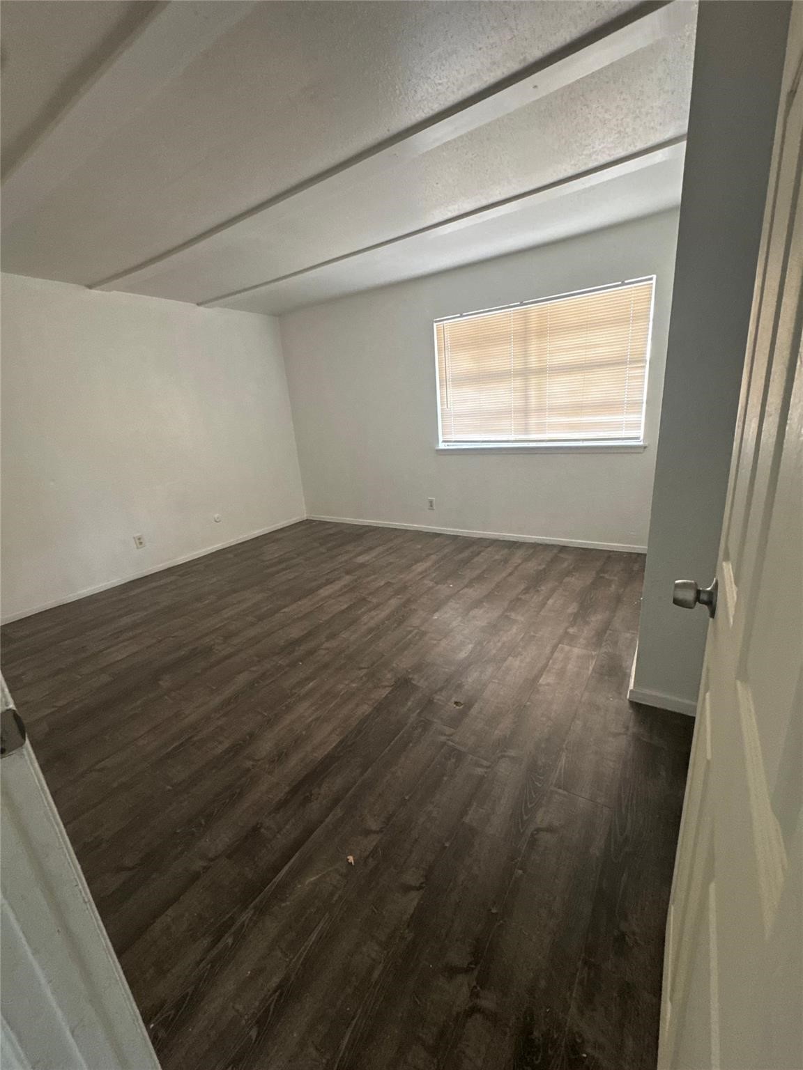 6200 West Tidwell Road, Unit 1205 Houston, TX 77092 - Photo 12 of 27 a view of an empty room and a window