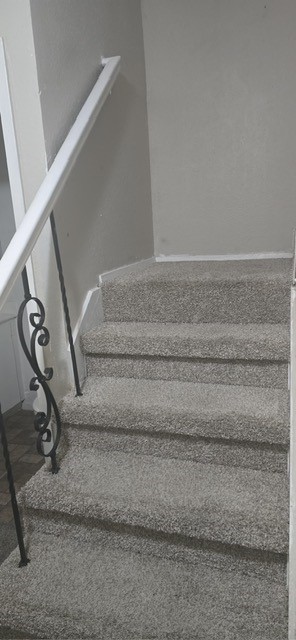 6200 West Tidwell Road, Unit 1205 Houston, TX 77092 - Photo 13 of 27 a view of staircase with white walls