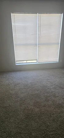 a living room with a sink and a toilet