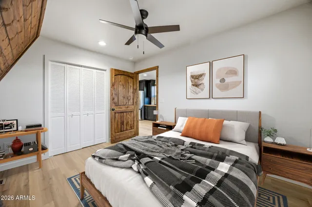 a sitting area with furniture and wooden floor