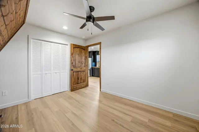 a view of a hallway with a kitchen