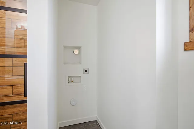 a view of hallway with wooden floor
