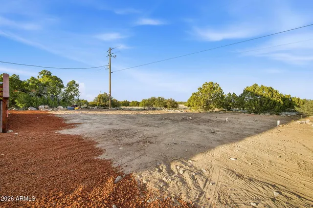 a view of roof deck with a yard