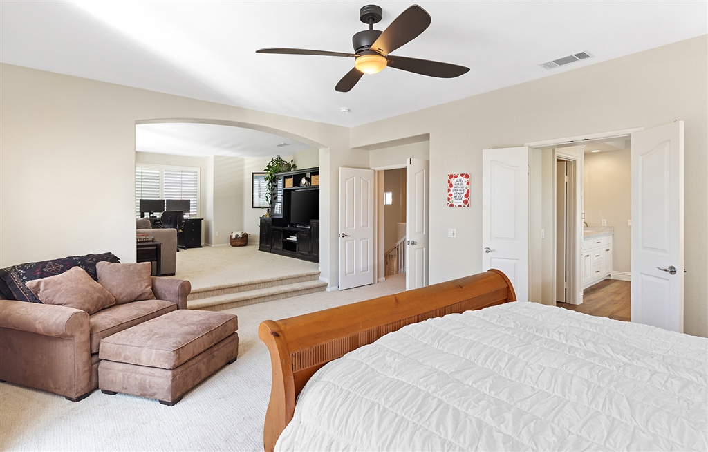 3445 Camino Alegre Carlsbad, CA 92009 - Photo 11 of 25 a bedroom with a large bed couch and a window