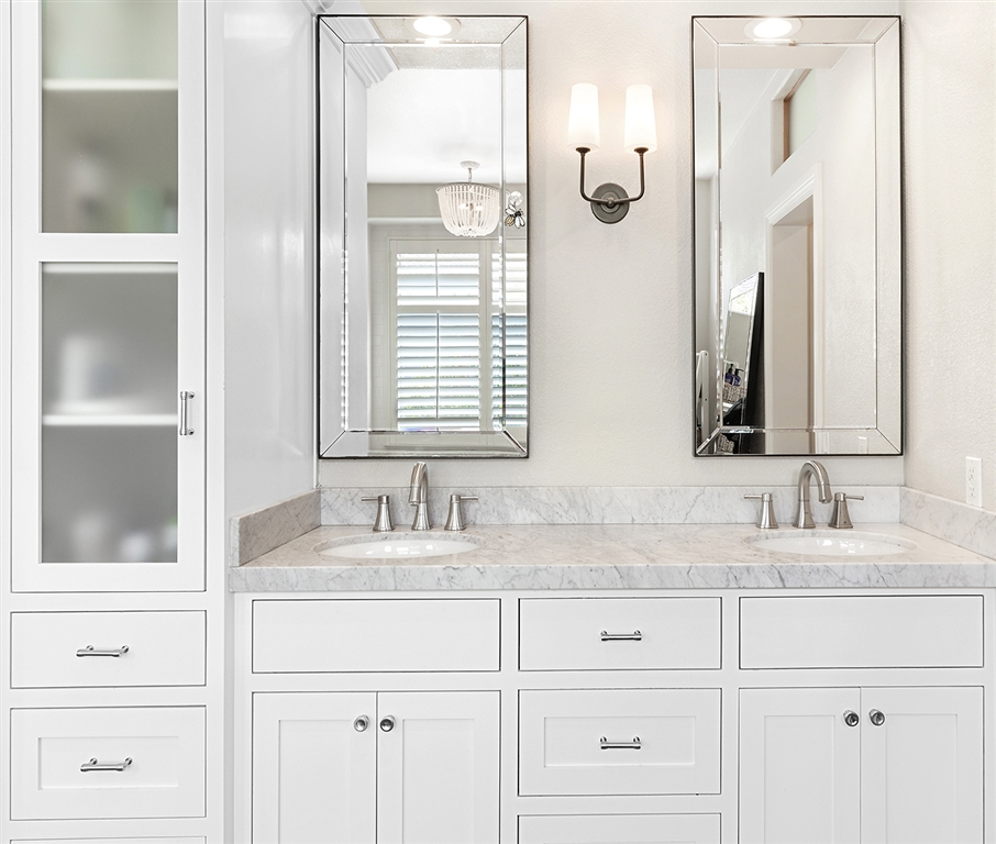 3445 Camino Alegre Carlsbad, CA 92009 - Photo 14 of 25 a bathroom with double sink and a mirror