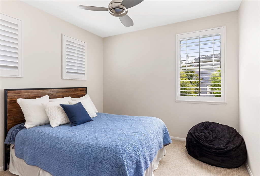 3445 Camino Alegre Carlsbad, CA 92009 - Photo 17 of 25 a bedroom with a bed and a window