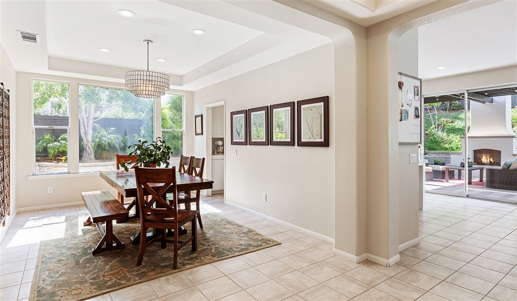 3445 Camino Alegre Carlsbad, CA 92009 - Photo 4 of 25 a view of a dining room with furniture window and outside view