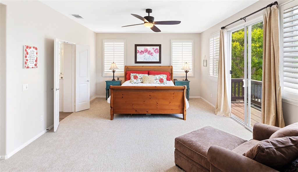 3445 Camino Alegre Carlsbad, CA 92009 - Photo 10 of 25 a living room with furniture and a large window