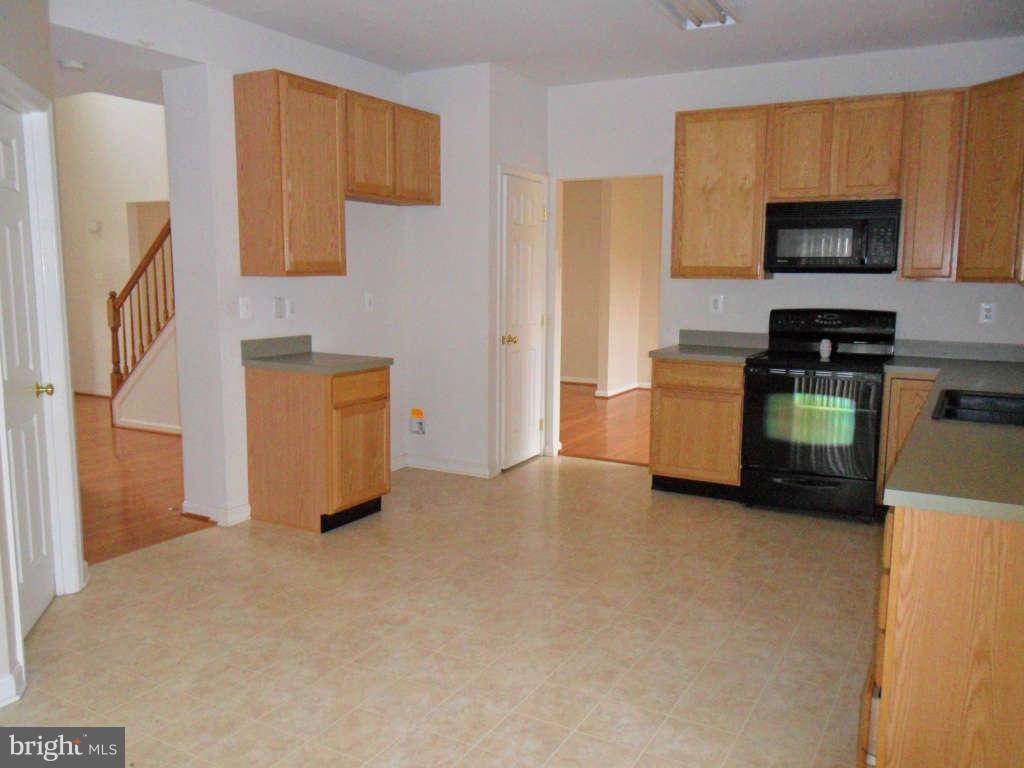 103 Ripe Berry Lane Martinsburg, WV 25403 - Photo 11 of 19 a view of living room and kitchen with furniture