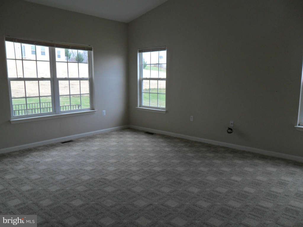 103 Ripe Berry Lane Martinsburg, WV 25403 - Photo 12 of 19 an empty room with a window