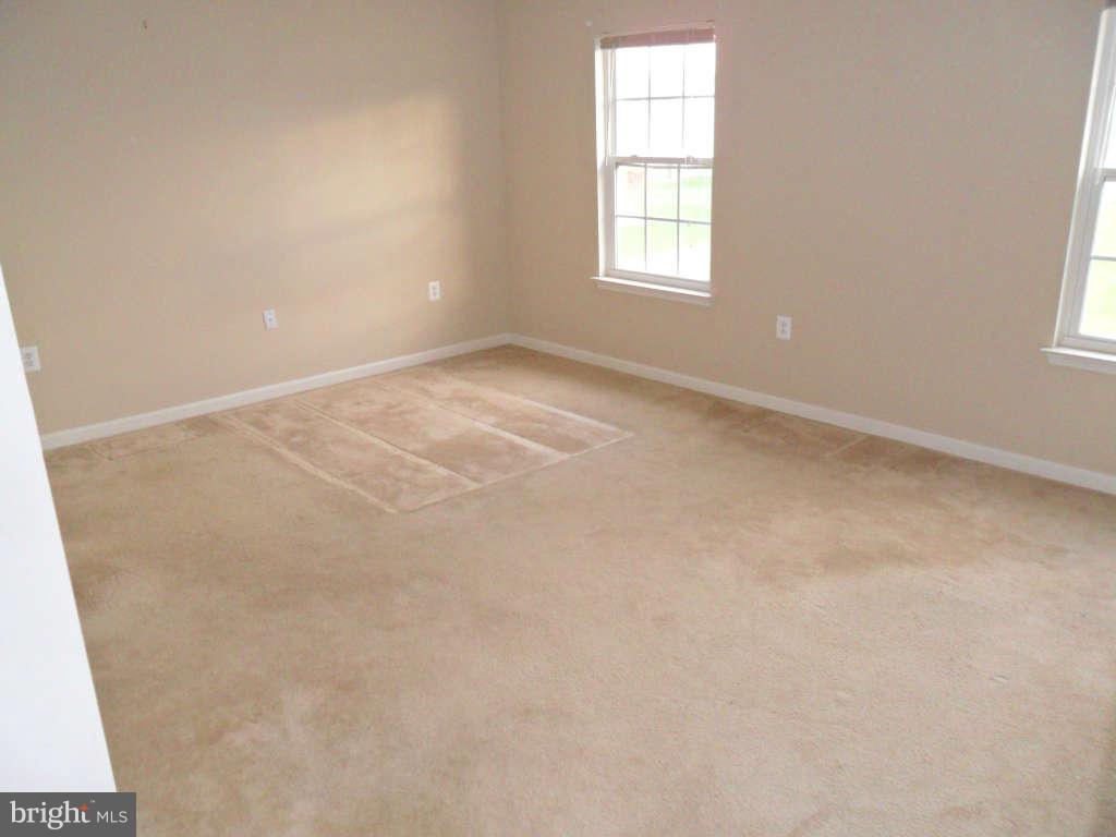 103 Ripe Berry Lane Martinsburg, WV 25403 - Photo 16 of 19 an empty room with a window