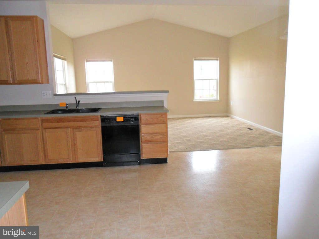 103 Ripe Berry Lane Martinsburg, WV 25403 - Photo 10 of 19 a large kitchen with stainless steel appliances granite countertop a stove a sink and a microwave
