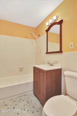 a bathroom with a toilet a sink and a bathtub