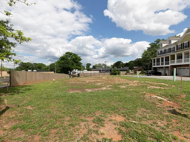 a view of building with river in front of it