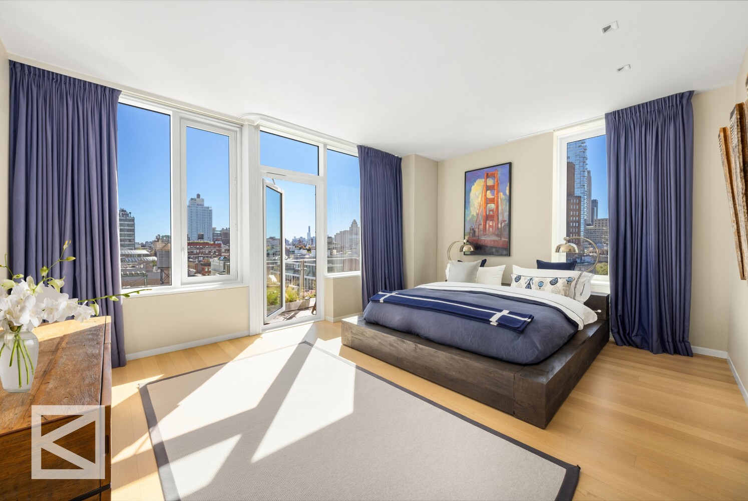 350 West Broadway, Unit PH Manhattan, NY 10013 - Photo 8 of 32 a spacious bedroom with a large bed and a chandelier