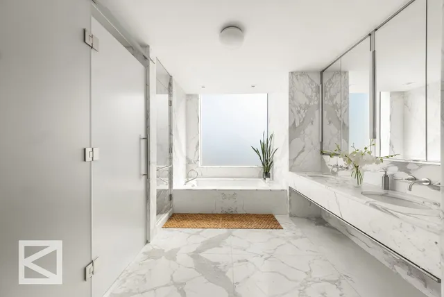 a living room with lots of furniture and painting on the wall