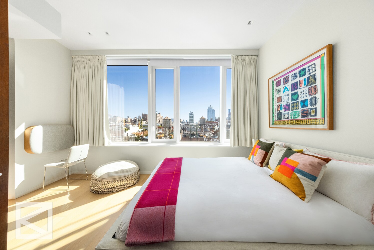 350 West Broadway, Unit PH Manhattan, NY 10013 - Photo 16 of 32 a bedroom with a bed and wooden floor