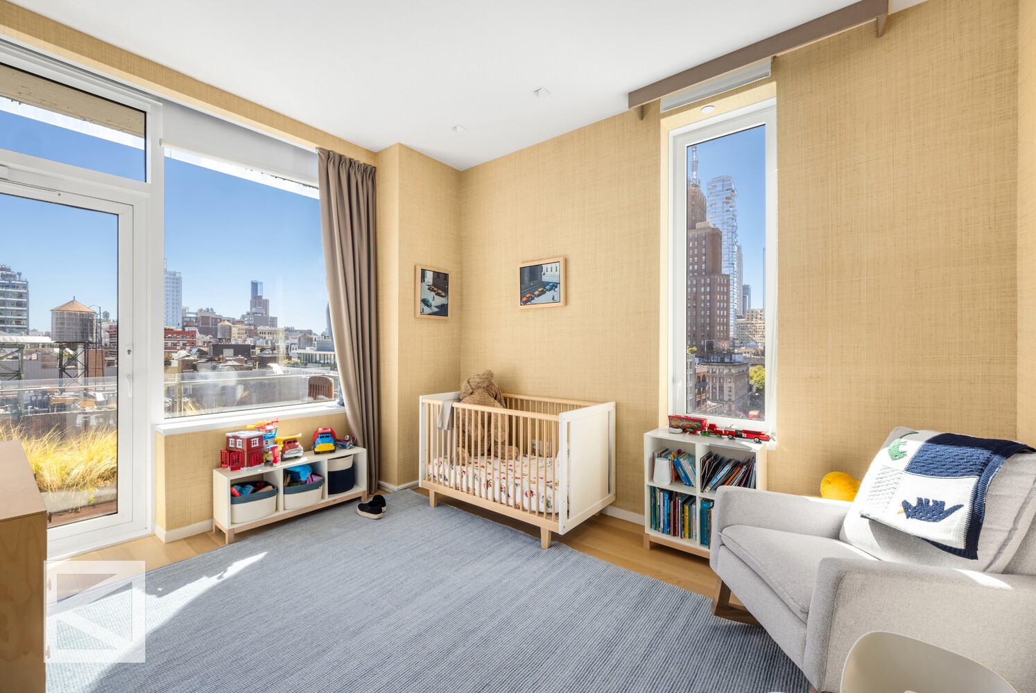 350 West Broadway, Unit PH Manhattan, NY 10013 - Photo 18 of 32 a living room with furniture and a flat screen tv