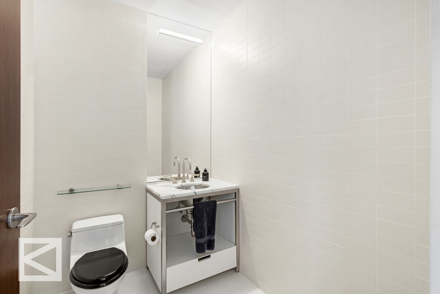 350 West Broadway, Unit PH Manhattan, NY 10013 - Photo 19 of 32 a bathroom with a sink a toilet and a mirror