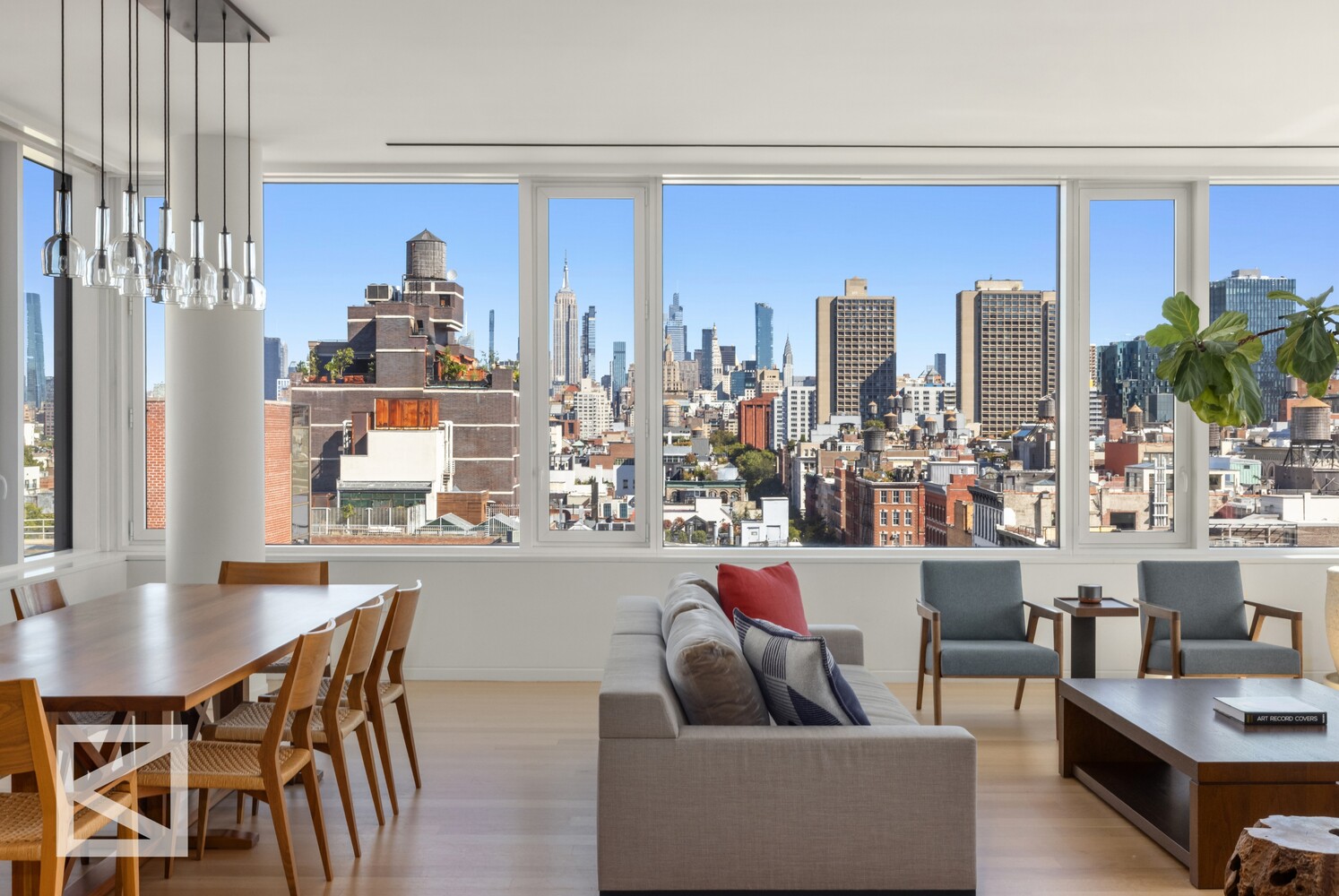 350 West Broadway, Unit PH Manhattan, NY 10013 - Photo 3 of 32 a living room with furniture a chandelier and a dining table