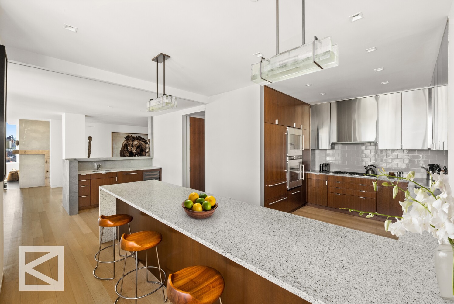 350 West Broadway, Unit PH Manhattan, NY 10013 - Photo 4 of 32 a kitchen with a sink a stove and chairs