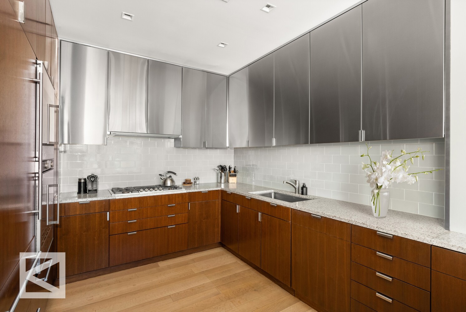 350 West Broadway, Unit PH Manhattan, NY 10013 - Photo 5 of 32 a kitchen with a sink a stove and cabinets