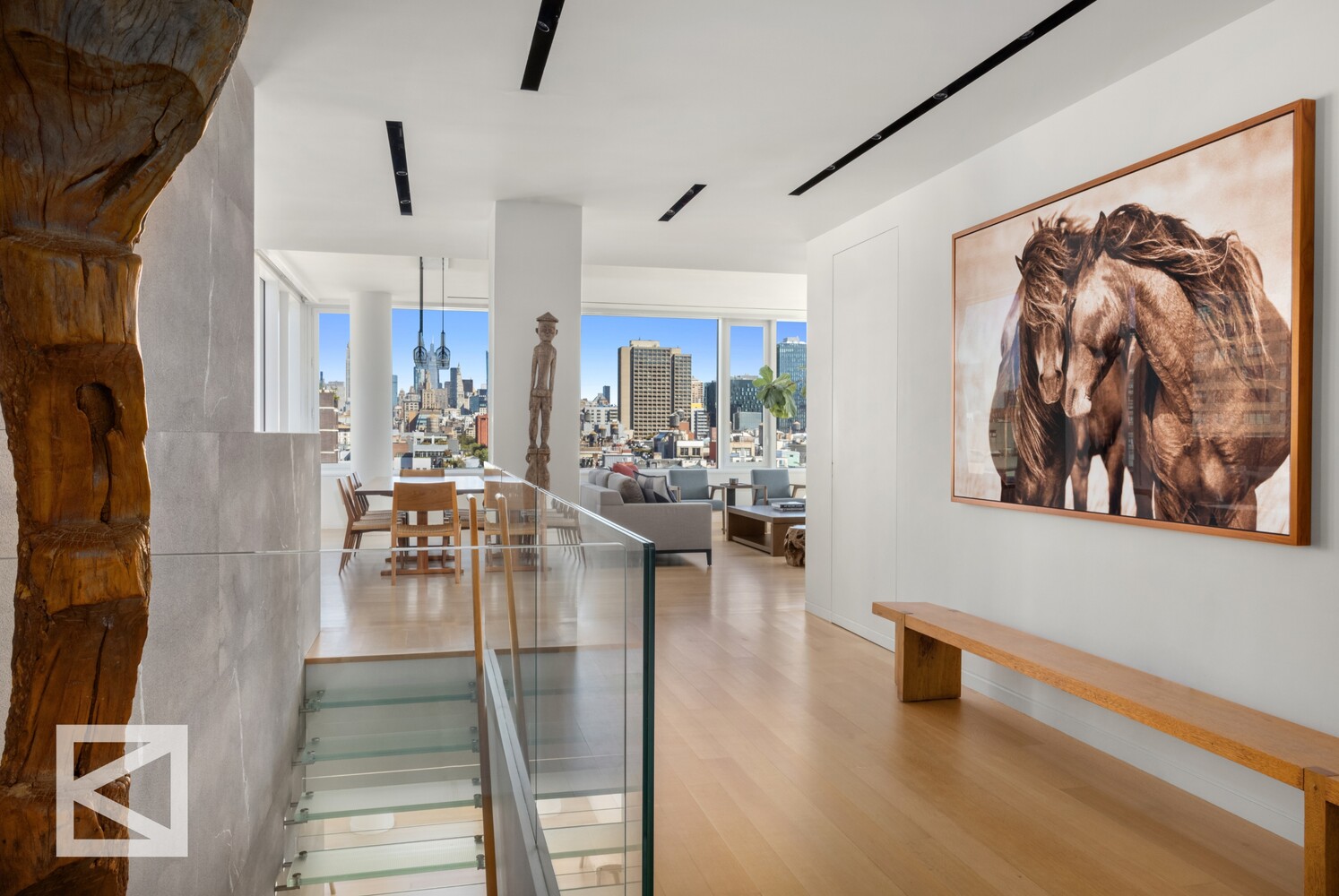 350 West Broadway, Unit PH Manhattan, NY 10013 - Photo 6 of 32 a living room with lots of furniture and painting on the wall