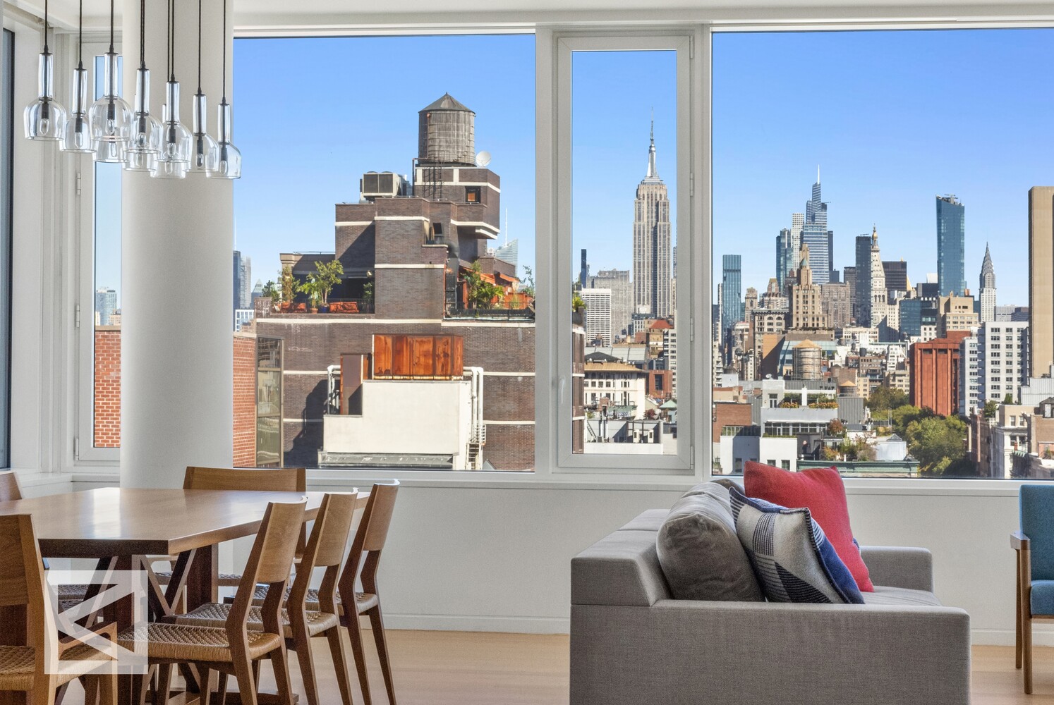 350 West Broadway, Unit PH Manhattan, NY 10013 - Photo 7 of 32 a view of a living room and kitchen with furniture