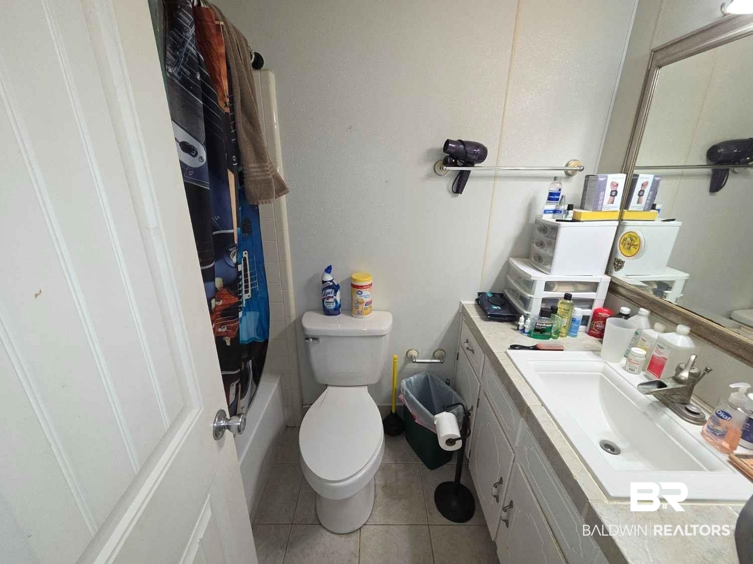 5120 West Celtic Drive Mobile, AL 36619 - Photo 13 of 27 Bathroom featuring vanity, tile patterned floors, and shower / bathtub combination with curtain
