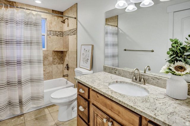 1320 Canyon Park Road Bountiful, UT 84010 - Photo 15 of 28 Bathroom with vanity, shower / bath combo with shower curtain, and light tile patterned floors
