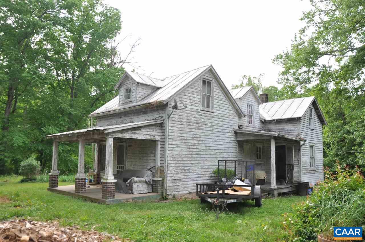 5634 Lowesville Road Arrington, VA 22922 - Photo 3 of 3 a front view of a house with a garden and yard
