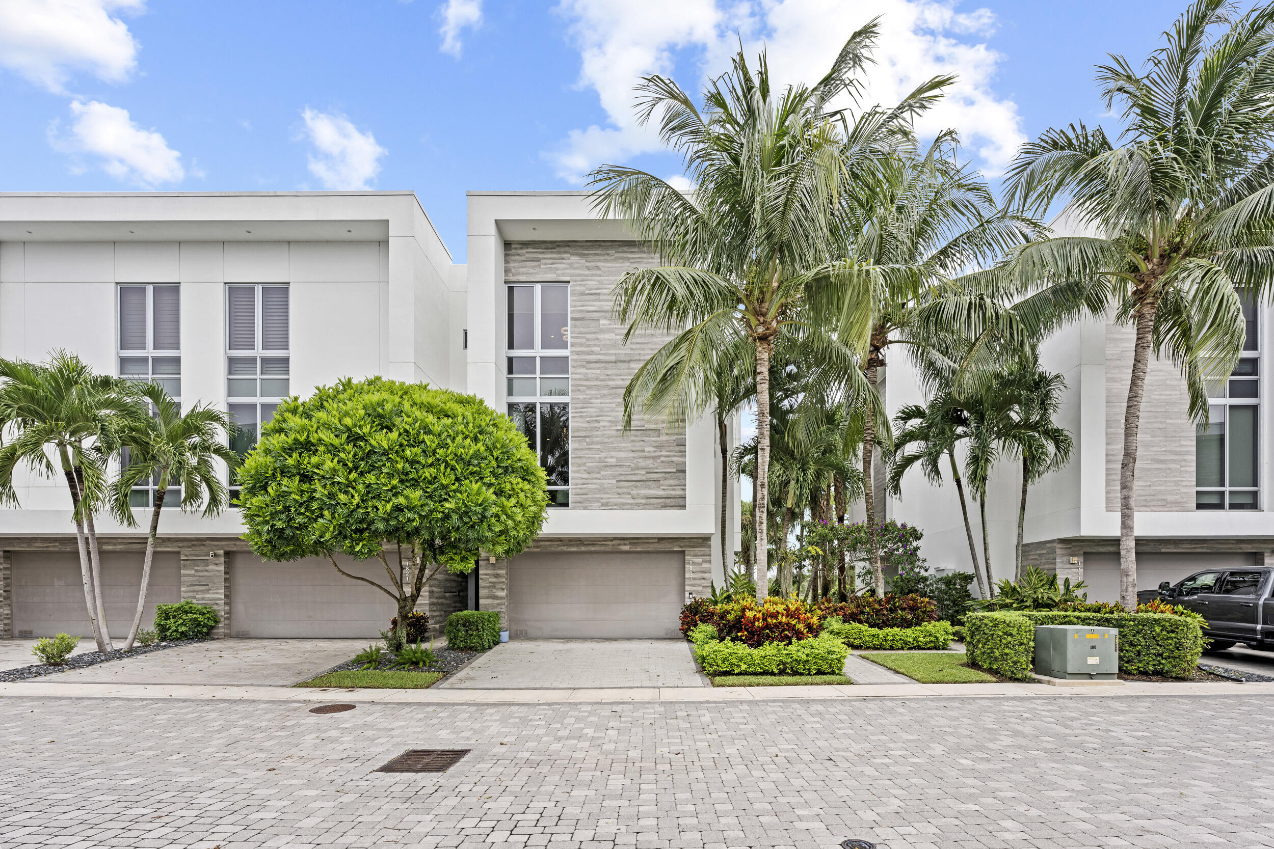 1811 Northwest 42nd Drive Boca Raton, FL 33431 - Photo 2 of 51 a front view of a house with garden