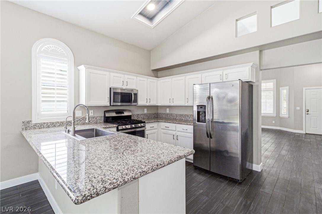 9523 Observer Street Las Vegas, NV 89123 - Photo 12 of 42 Culinary creations come to life in a modern kitchen with ample counter space and state-of-the-art appliances.