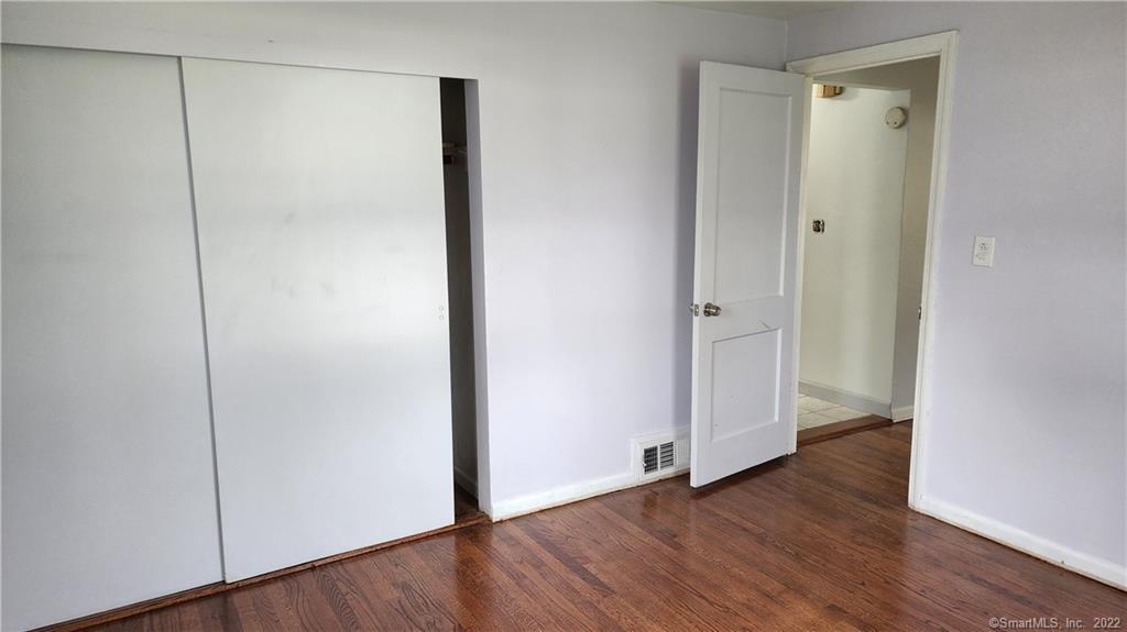 25 Madsen Road West Hartford, CT 06110 - Photo 7 of 16 a view of an empty room with wooden floor