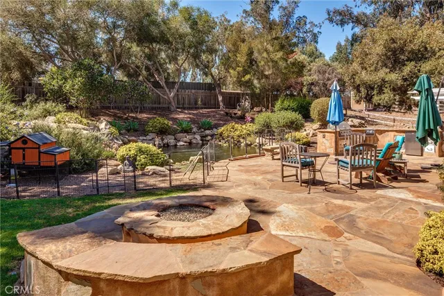 a view of a swimming pool with outdoor seating